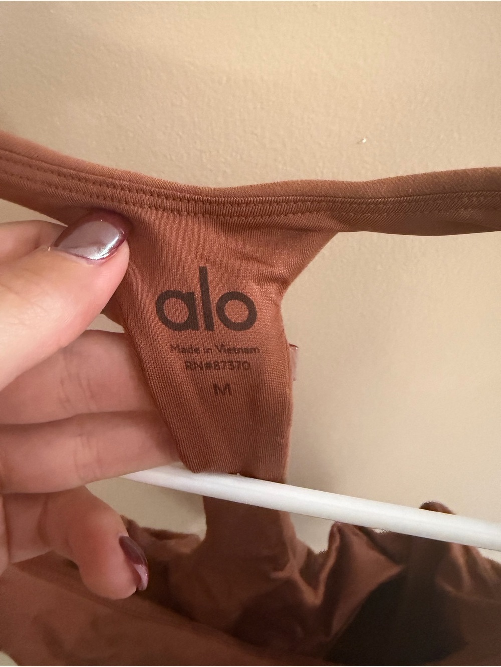 ALO Yoga women’s burnt orange bodysuit